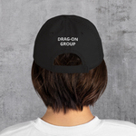 Black; Torn distressed dad hat with embroidered "Outsider" graphic of tent, tree, and moon