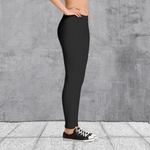 Black spandex stretch leggings with large Drag-On logo on thigh