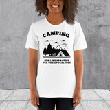 Woman in White t-shirt with "Camping: It's like practice for the apocalypse" and graphic of tent, mountains, and evergreen trees.