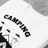 Close-up of White t-shirt with "Camping: It's like practice for the apocalypse" and graphic of tent, mountains, and evergreen trees.